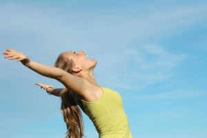 woman raising her hands