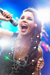 woman singing with a microphone