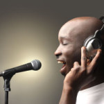 man singing with headset and microphone